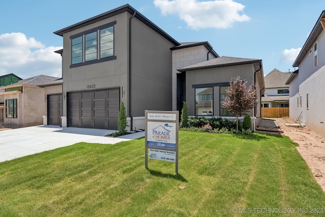 12622 S Granite Ave E, Bixby, OK 74008 - contemporary home with driveway, a garage, a front yard, and stucco siding