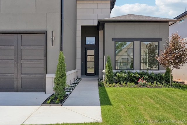 12622 S Granite Ave E, Bixby, OK 74008 - doorway to property with a lawn and stucco siding