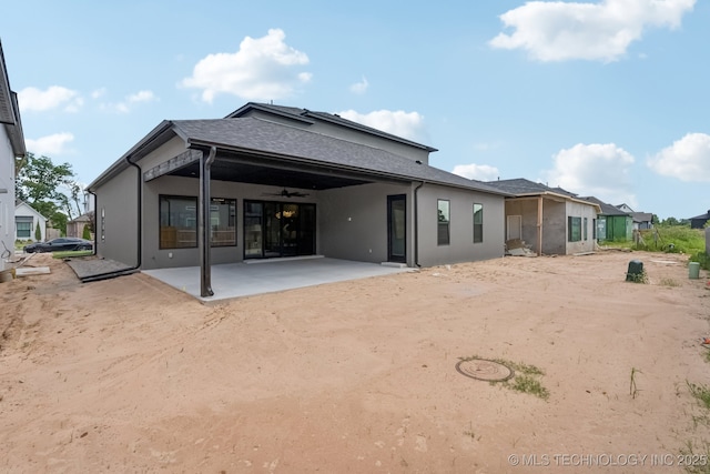 12622 S Granite Ave E, Bixby, OK 74008 - back of property with a ceiling fan, a patio area, and stucco siding