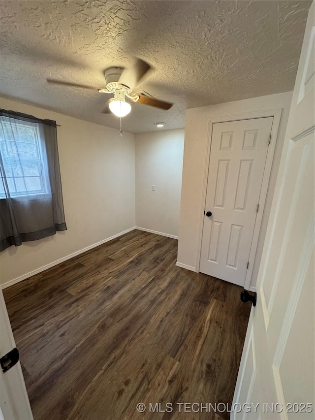 14274 W Clyde Maher, Tahlequah, OK 74464 - unfurnished bedroom with dark wood-style floors, a textured ceiling, and a ceiling fan