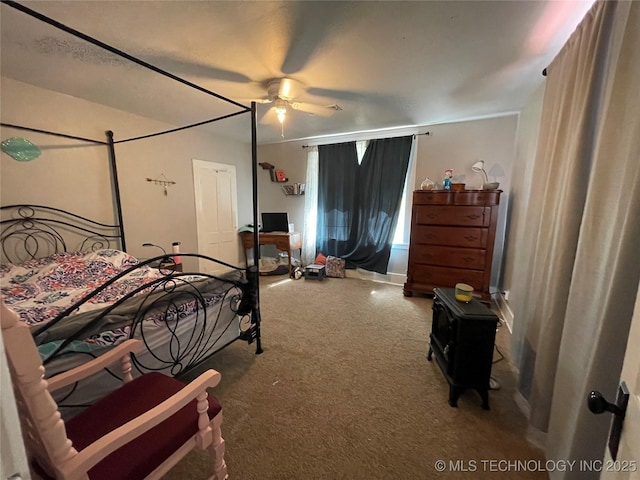 307 NE A St, Antlers, OK 74523 - carpeted bedroom with a ceiling fan and baseboards