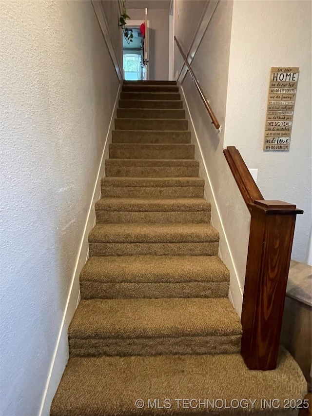 307 NE A St, Antlers, OK 74523 - staircase featuring a textured wall
