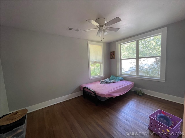 307 NE A St, Antlers, OK 74523 - bedroom featuring wood finished floors and a ceiling fan