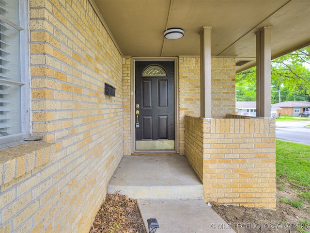 4512 SE Frank Phillips Blvd, Bartlesville, OK 74006 - entrance to property with brick siding and a porch