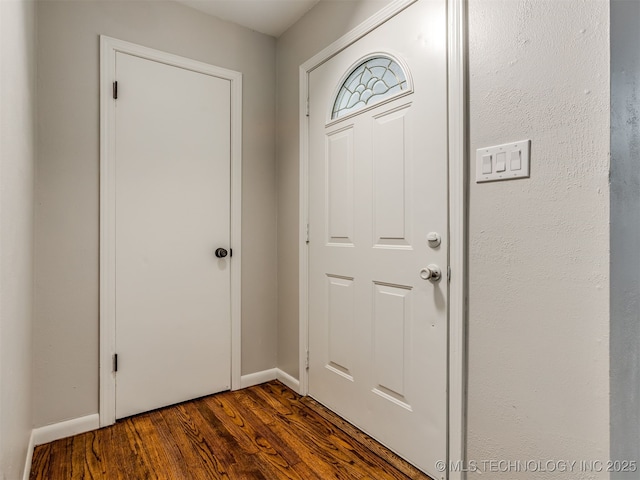 4512 SE Frank Phillips Blvd, Bartlesville, OK 74006 - entrance foyer with dark wood-style flooring and baseboards