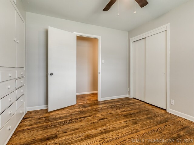 4512 SE Frank Phillips Blvd, Bartlesville, OK 74006 - unfurnished bedroom with wood finished floors, a closet, and a ceiling fan