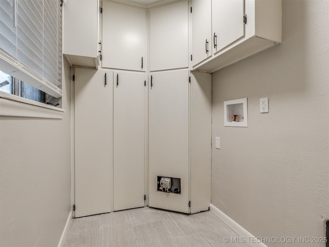 4512 SE Frank Phillips Blvd, Bartlesville, OK 74006 - washroom with cabinet space and hookup for a washing machine