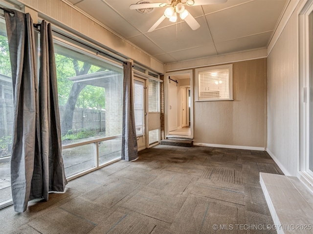 4512 SE Frank Phillips Blvd, Bartlesville, OK 74006 - unfurnished room featuring ceiling fan and dark colored carpet