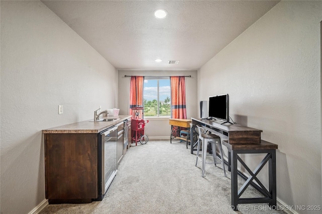 18820 S Kiowa Rd, Claremore, OK 74017 - office area featuring light carpet, a textured wall, and recessed lighting