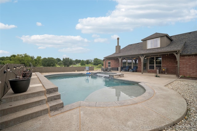 18820 S Kiowa Rd, Claremore, OK 74017 - view of pool featuring a patio area, a pool with connected hot tub, and a fenced backyard