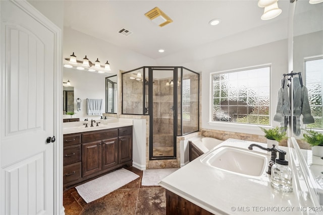 18820 S Kiowa Rd, Claremore, OK 74017 - full bath with plenty of natural light, vanity, a stall shower, a garden tub, and recessed lighting