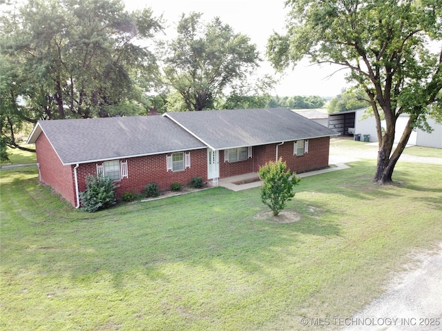 1604 N 2nd Ave, Warner, OK 74469 - single story home with brick siding, a front lawn, a shingled roof, and driveway