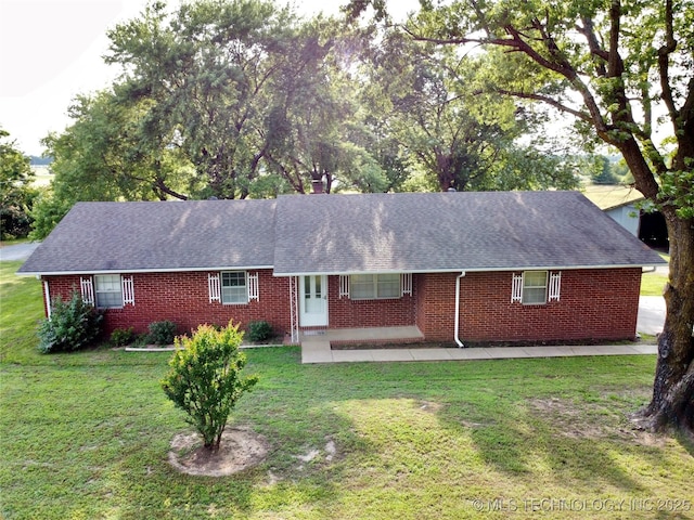1604 N 2nd Ave, Warner, OK 74469 - single story home featuring brick siding, a front yard, and roof with shingles