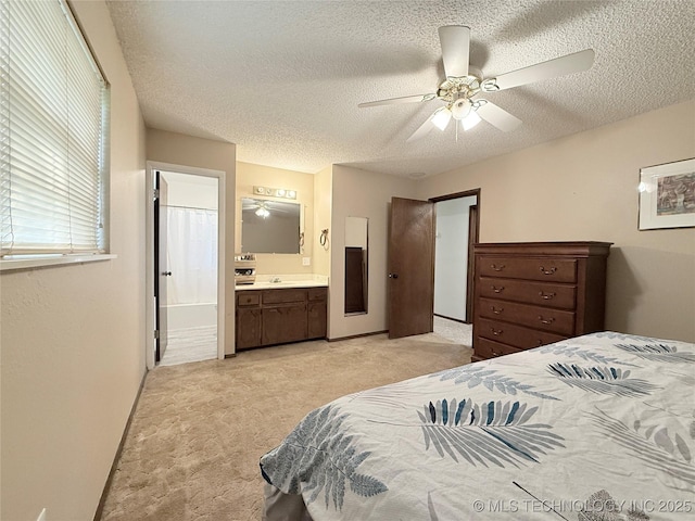 1604 N 2nd Ave, Warner, OK 74469 - bedroom with light colored carpet, a textured ceiling, ensuite bathroom, and ceiling fan