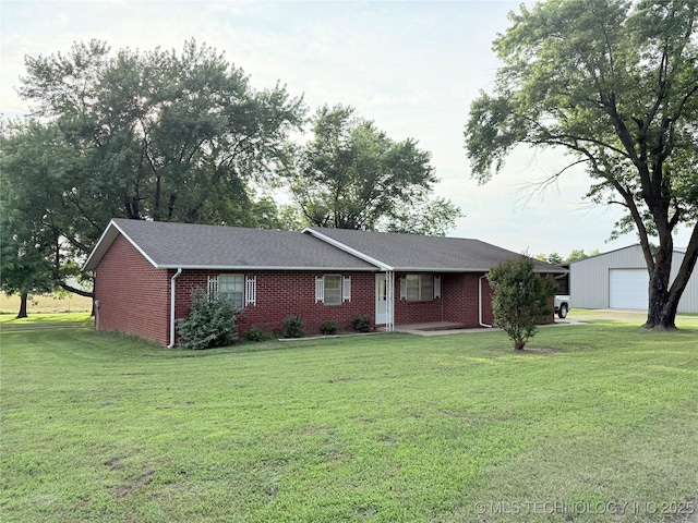 1604 N 2nd Ave, Warner, OK 74469 - ranch-style house featuring a front yard, brick siding, and a garage