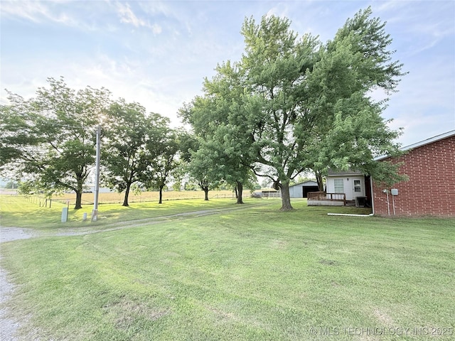 1604 N 2nd Ave, Warner, OK 74469 - view of grassy yard with a deck