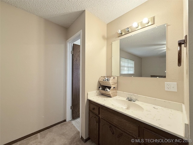1604 N 2nd Ave, Warner, OK 74469 - bathroom featuring vanity and a textured ceiling