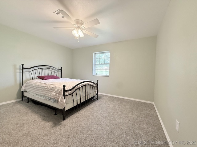 1604 N 2nd Ave, Warner, OK 74469 - bedroom with carpet floors and a ceiling fan