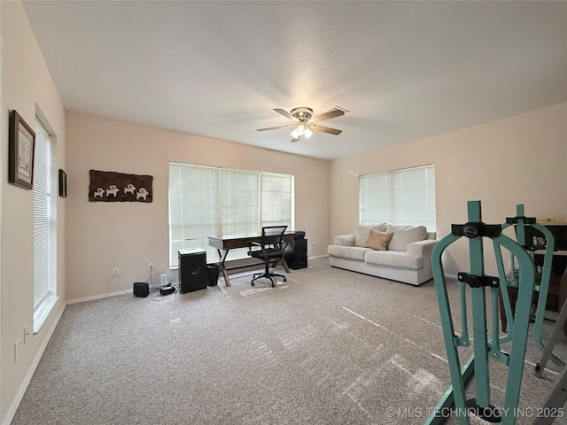 1604 N 2nd Ave, Warner, OK 74469 - carpeted home office with a ceiling fan and baseboards