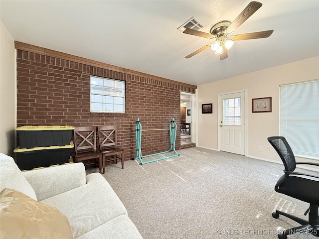 1604 N 2nd Ave, Warner, OK 74469 - carpeted home office with brick wall and a ceiling fan