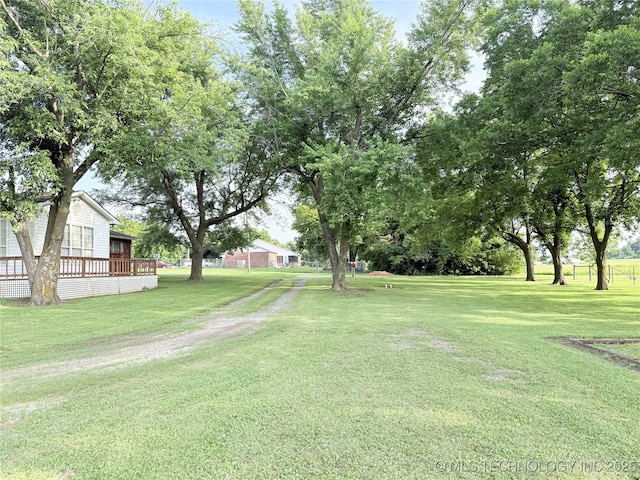 1604 N 2nd Ave, Warner, OK 74469 - view of grassy yard with a wooden deck