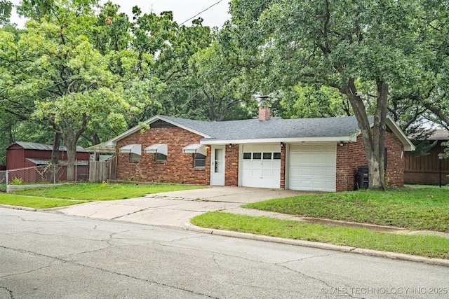 104 Laurel Pl, Bartlesville, OK 74003 - ranch-style home with a garage, brick siding, driveway, a chimney, and roof with shingles