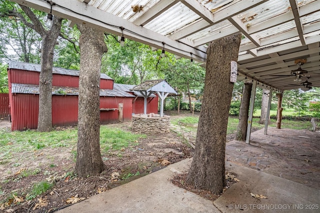 104 Laurel Pl, Bartlesville, OK 74003 - view of yard with ceiling fan and an outdoor structure