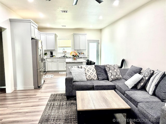 2125 N Lansing Ave W, Tulsa, OK 74106 - living area featuring light wood-style floors and recessed lighting