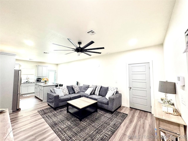 2125 N Lansing Ave W, Tulsa, OK 74106 - living room with light wood-type flooring and a ceiling fan