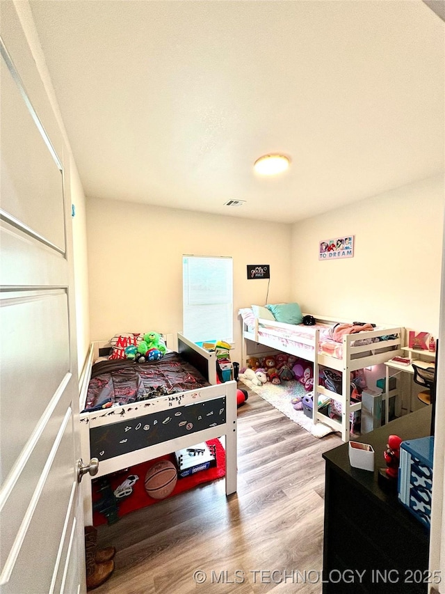 2125 N Lansing Ave W, Tulsa, OK 74106 - bedroom featuring wood finished floors