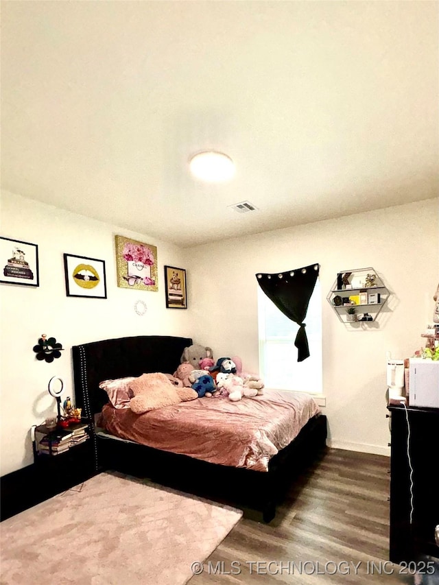 2125 N Lansing Ave W, Tulsa, OK 74106 - bedroom with wood finished floors and baseboards