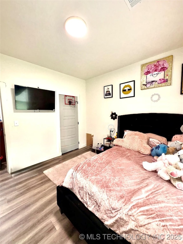 2125 N Lansing Ave W, Tulsa, OK 74106 - bedroom featuring wood finished floors