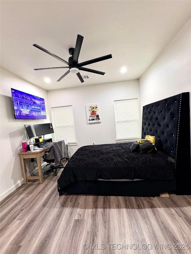 2125 N Lansing Ave W, Tulsa, OK 74106 - bedroom featuring wood finished floors, a ceiling fan, and recessed lighting