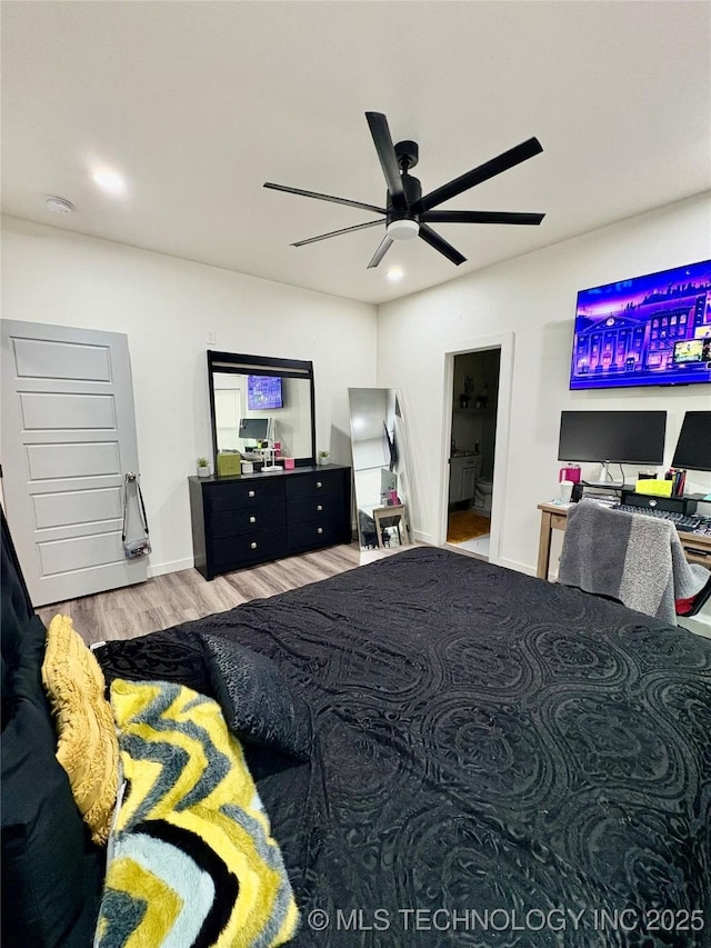 2125 N Lansing Ave W, Tulsa, OK 74106 - bedroom featuring wood finished floors and a ceiling fan