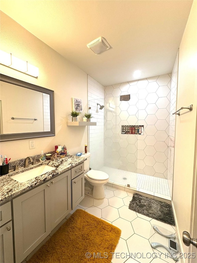 2125 N Lansing Ave W, Tulsa, OK 74106 - full bath with vanity, tiled shower, and tile patterned floors