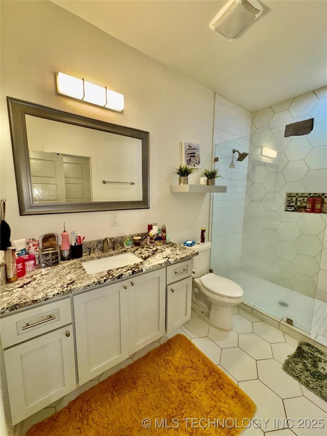 2125 N Lansing Ave W, Tulsa, OK 74106 - full bathroom featuring tiled shower, vanity, and tile patterned floors