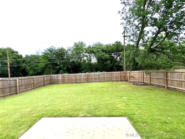 2125 N Lansing Ave W, Tulsa, OK 74106 - fenced backyard with a patio