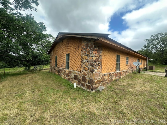 51698 W 139th St S, Drumright, OK 74030 - view of side of property featuring stone siding and a yard