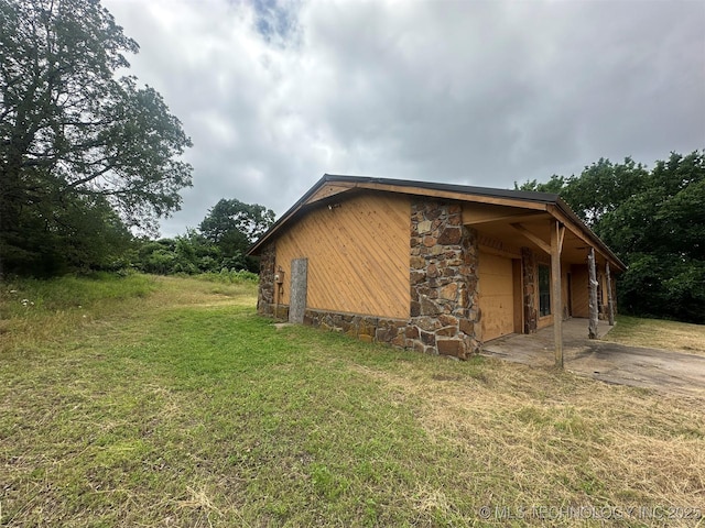 51698 W 139th St S, Drumright, OK 74030 - view of home's exterior featuring a lawn