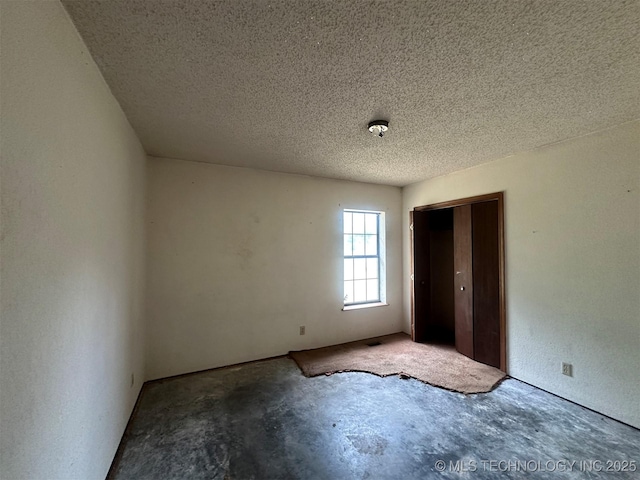51698 W 139th St S, Drumright, OK 74030 - spare room with unfinished concrete floors and a textured ceiling