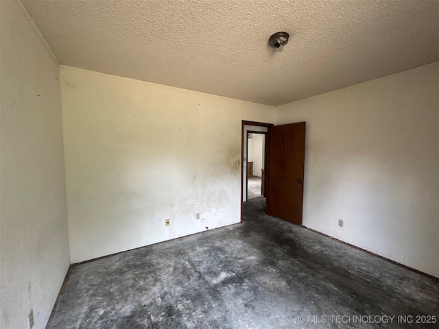 51698 W 139th St S, Drumright, OK 74030 - unfurnished room with unfinished concrete flooring and a textured ceiling
