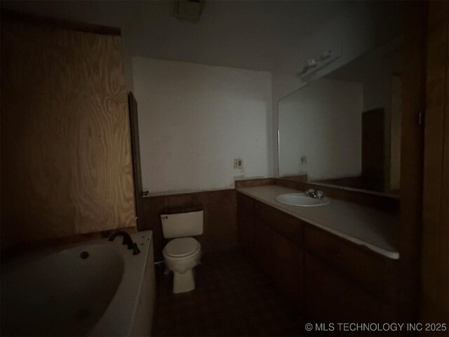 51698 W 139th St S, Drumright, OK 74030 - bathroom featuring vanity, a garden tub, and tile patterned flooring