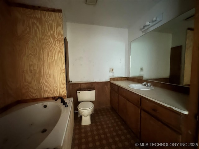 51698 W 139th St S, Drumright, OK 74030 - bathroom with a wainscoted wall, a jetted tub, and vanity