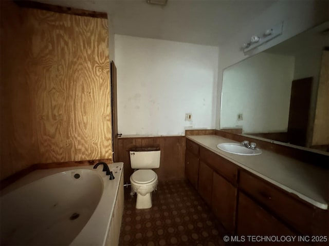 51698 W 139th St S, Drumright, OK 74030 - full bath featuring a whirlpool tub, vanity, and wainscoting
