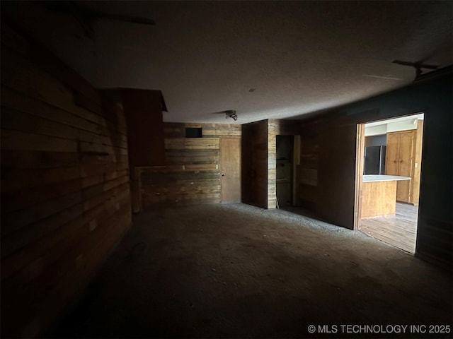 51698 W 139th St S, Drumright, OK 74030 - carpeted empty room with wood walls