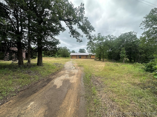 51698 W 139th St S, Drumright, OK 74030 - view of front of home with dirt driveway and a detached garage