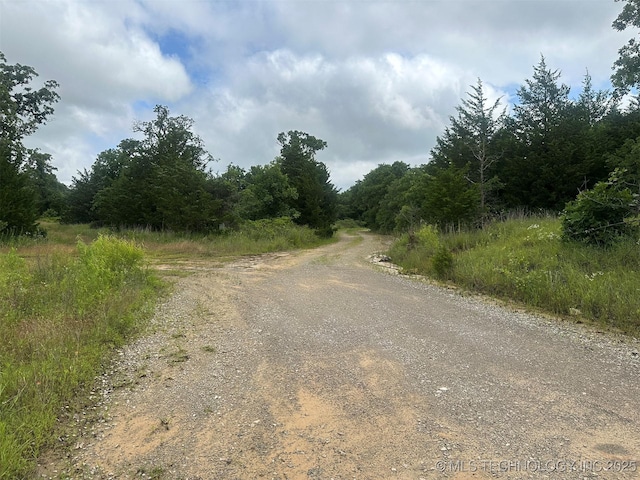 51698 W 139th St S, Drumright, OK 74030 - view of dirt / gravel road featuring a forest view