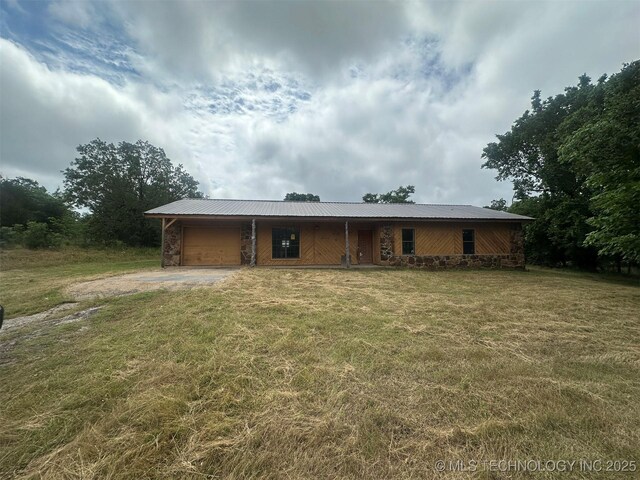 51698 W 139th St S, Drumright, OK 74030 - view of front of home with a garage, driveway, a front yard, and a metal roof