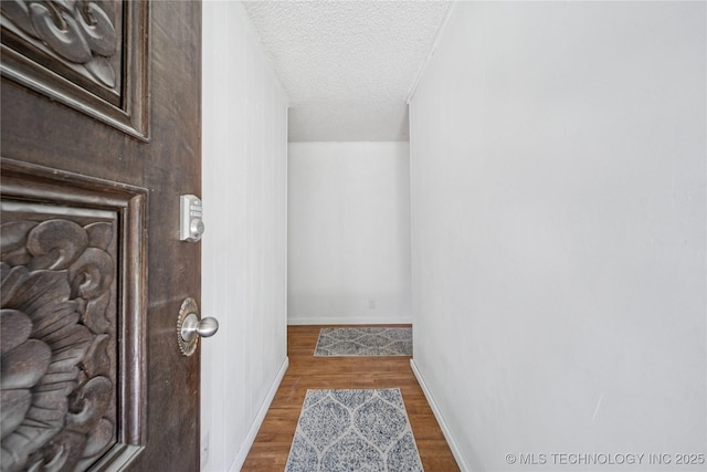 9025 N 156th Rd, Beggs, OK 74421 - interior space with a textured ceiling and wood finished floors