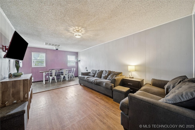 9025 N 156th Rd, Beggs, OK 74421 - living area with light wood-style floors, a textured ceiling, and crown molding